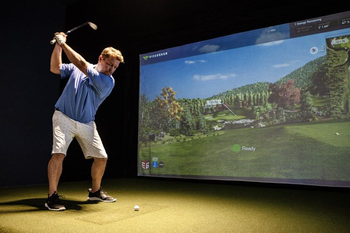 Playing golf on a simulator